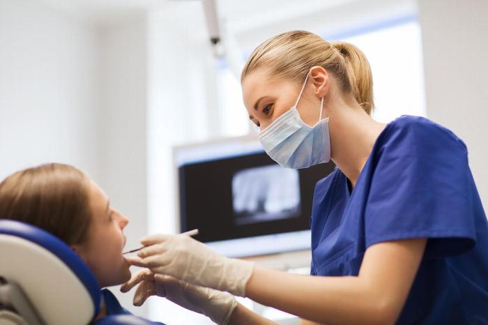 Dental nurse with patient